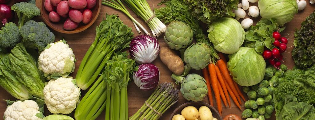 a bunch of colorful vegetables on a table