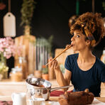 Woman sampling banana bread batter