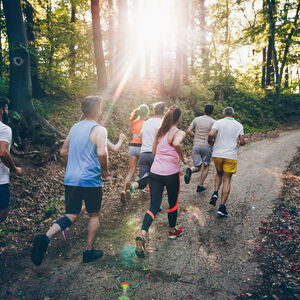 Group running down trail