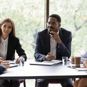 A group of people in a meeting discussion