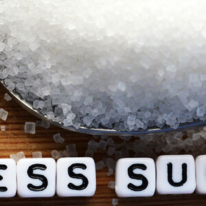 Image of a spoonful of sugar with the text less sugar below it