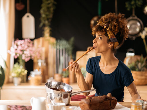 Woman sampling banana bread batter