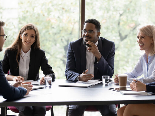 A group of people in a meeting discussion