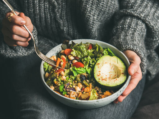 woman holding vegan food